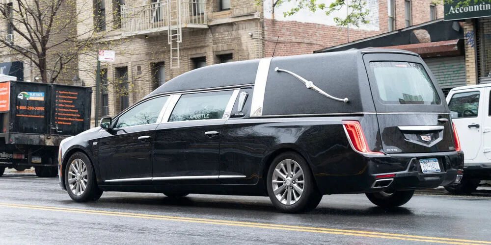 hearse-or-funeral-car-on-the-street-1000x500.webp