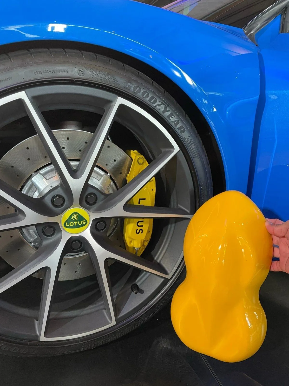 Lotus Emira - Hethel Yellow vs Brake Caliper vs Lotus Badge.webp